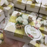 Flower Box With Zari Ribbon And Tai
